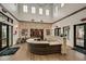 Inviting lobby with wood flooring, stone accent walls, soaring ceiling, and comfortable seating at 9396 Minnow Ray Dr, Land O Lakes, FL 34638