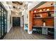The modern lobby features stylish lighting, wood floors, and a convenient built-in workspace at 9396 Minnow Ray Dr, Land O Lakes, FL 34638