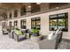 A comfortable outdoor lounge has cushioned seating and views of the pool for relaxation and community enjoyment at 9396 Minnow Ray Dr, Land O Lakes, FL 34638