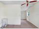 Bedroom with tan carpet and white walls at 10130 Burton St, New Port Richey, FL 34654