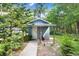 Exterior view of a shed with a single door and a gray exterior at 10130 Burton St, New Port Richey, FL 34654