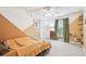 Cozy bedroom features a ceiling fan, closet, and built-in shelving, perfect for a room at 10223 Charleston Corner Rd, Tampa, FL 33635