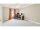 Neutral bedroom features carpet floors, a ceiling fan and ample space for an office or relaxing at 10223 Charleston Corner Rd, Tampa, FL 33635