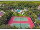An aerial view showcasing the community tennis courts, playground and swimming pool at 10223 Charleston Corner Rd, Tampa, FL 33635