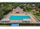 Community center featuring a pool, lounging areas, and manicured landscaping, for neighborhood residents at 10223 Charleston Corner Rd, Tampa, FL 33635