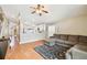 Inviting living room with a comfortable sectional sofa, ceiling fan and open access to the kitchen at 10223 Charleston Corner Rd, Tampa, FL 33635