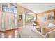 Open living area featuring a vaulted ceiling, bay window, and carpet floors at 10223 Charleston Corner Rd, Tampa, FL 33635