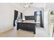 Spacious main bedroom featuring a large bed, carpeted floors, and access to the ensuite bathroom at 10223 Charleston Corner Rd, Tampa, FL 33635