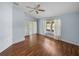 Bedroom showcasing hardwood floors, a ceiling fan, and bright natural light at 10324 Chatuge Dr, San Antonio, FL 33576
