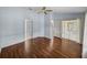 Spacious bedroom featuring hardwood floors and a ceiling fan at 10324 Chatuge Dr, San Antonio, FL 33576