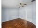 Bright bedroom showcasing hardwood floors and a ceiling fan at 10324 Chatuge Dr, San Antonio, FL 33576