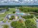 Aerial shot of the club house featuring a pool and golf course in Tampa Bay Golf and Country Club at 10324 Chatuge Dr, San Antonio, FL 33576