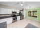 Bright kitchen with white cabinetry, stainless steel appliances, and eat-in dining space at 10324 Chatuge Dr, San Antonio, FL 33576