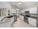 Bright kitchen boasts stainless steel appliances, breakfast bar, and easy flow to living areas at 10324 Chatuge Dr, San Antonio, FL 33576
