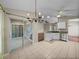 Open kitchen design with tiled floor, granite countertops, and stainless steel appliances at 10324 Chatuge Dr, San Antonio, FL 33576