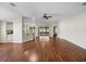 A spacious living room with hardwood floors, neutral-colored walls, and views of the backyard at 10324 Chatuge Dr, San Antonio, FL 33576