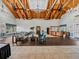 Community lobby with exposed wood beams, chandelier lighting, tiled floors, and a reception desk at 10324 Chatuge Dr, San Antonio, FL 33576