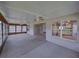 Covered outdoor patio showing adjacent sunroom, access to home, and window to kitchen at 10324 Chatuge Dr, San Antonio, FL 33576