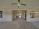 Covered outdoor patio showcasing access to the home's interior and adjacent kitchen area at 10324 Chatuge Dr, San Antonio, FL 33576