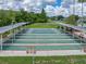 Overhead view of shuffleboard courts, covered benches and lush landscaping in the Tampa Bay Golf and Country Club at 10324 Chatuge Dr, San Antonio, FL 33576