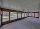 Sunroom featuring windows with views of the golf course at 10324 Chatuge Dr, San Antonio, FL 33576