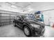 Spacious garage featuring ample storage, a car, and an automatic door at 11315 86Th Ave, Seminole, FL 33772