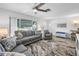 Inviting living room with comfortable seating, a textured rug, and a large window providing ample natural light at 11315 86Th Ave, Seminole, FL 33772