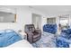 Comfortable living area featuring a large window, a couch with a starfish pattern and recliner at 11315 86Th Ave, Seminole, FL 33772