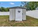 Outdoor storage shed with a pegasus emblem, located in the backyard of the property at 11315 86Th Ave, Seminole, FL 33772
