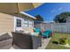 Backyard patio with outdoor seating, a new fence, and ample shade at 1142 56Th N Ave, St Petersburg, FL 33703
