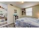 Inviting bedroom with a stylish bookshelf and access to another room, filled with natural light at 1142 56Th N Ave, St Petersburg, FL 33703