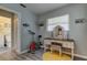 A quaint bedroom featuring an exercise bike and vanity with a yellow rug beneath it at 1142 56Th N Ave, St Petersburg, FL 33703