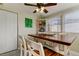 Dining room features a rustic table and built-in display shelves at 1142 56Th N Ave, St Petersburg, FL 33703