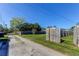 Gravel driveway runs alongside a fenced yard, creating a private and spacious outdoor area at 1142 56Th N Ave, St Petersburg, FL 33703