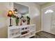Charming foyer featuring stylish decor, a decorative mirror, and modern flooring, adjacent to the front door at 1142 56Th N Ave, St Petersburg, FL 33703