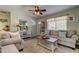 Cozy living room with comfortable seating, ceiling fan, area rug and an abundance of natural light at 1142 56Th N Ave, St Petersburg, FL 33703