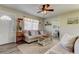 Inviting living room with neutral decor, plush sofa, and a large window, creating a comfortable atmosphere at 1142 56Th N Ave, St Petersburg, FL 33703