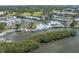 Beautiful aerial view of community buildings, pool, boat docks, tennis courts, and lush green landscaping at 11510 Shipwatch Dr # 1375, Largo, FL 33774
