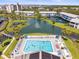 An aerial view features the community pool, waterfront access and meticulously kept grounds at 11510 Shipwatch Dr # 1375, Largo, FL 33774