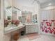 Bathroom boasting large mirrors, vanity lighting, and a patterned shower curtain at 11510 Shipwatch Dr # 1375, Largo, FL 33774