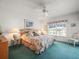 Serene bedroom featuring a ceiling fan, natural light, and a comfortable bed at 11510 Shipwatch Dr # 1375, Largo, FL 33774