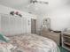 Bright bedroom featuring closet, dresser, and carpeted floors at 11510 Shipwatch Dr # 1375, Largo, FL 33774