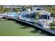 Exterior of building near waterway with outdoor seating area, and community pool in the background at 11510 Shipwatch Dr # 1375, Largo, FL 33774