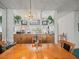Dining area with stylish chandelier, wood cabinets, and decorative items at 11510 Shipwatch Dr # 1375, Largo, FL 33774