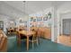 Open dining area with stylish chandelier, mirrored wall, and decorative accents above the wood cabinets at 11510 Shipwatch Dr # 1375, Largo, FL 33774
