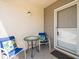 Cozy front patio with table and chairs, ideal for relaxing outside at 11510 Shipwatch Dr # 1375, Largo, FL 33774