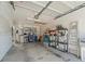 A spacious garage with plenty of shelving for storage and well lit ceiling at 11510 Shipwatch Dr # 1375, Largo, FL 33774