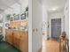 Bright kitchen with wood cabinets and a view into the dining area and front door at 11510 Shipwatch Dr # 1375, Largo, FL 33774
