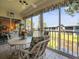 Enclosed lanai offering a relaxing view of the canal with comfortable seating for outdoor enjoyment at 11510 Shipwatch Dr # 1375, Largo, FL 33774