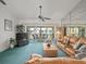 Bright living room featuring comfortable seating and a view of the lanai at 11510 Shipwatch Dr # 1375, Largo, FL 33774